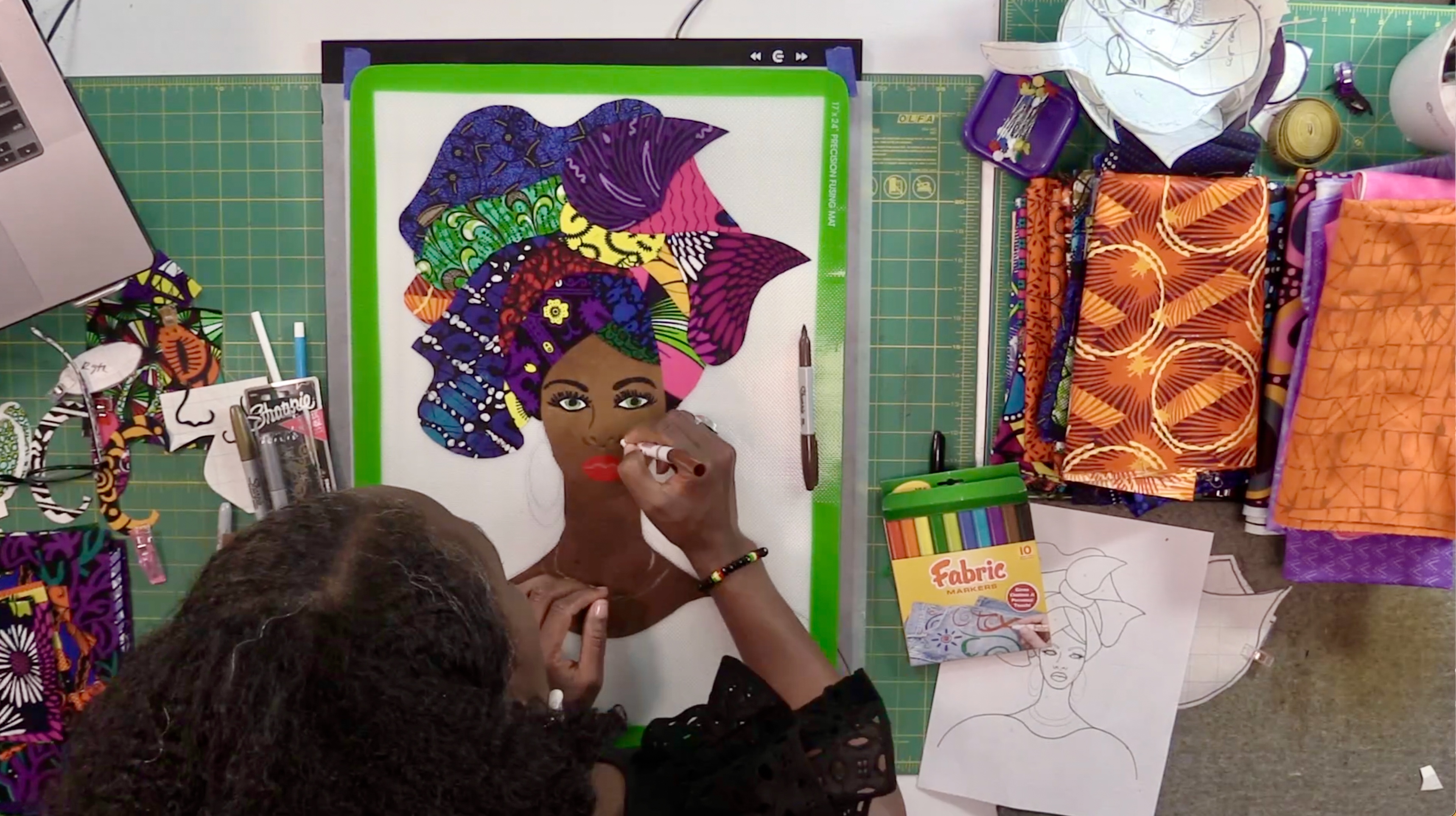 Instructor drawing on appliqué pattern